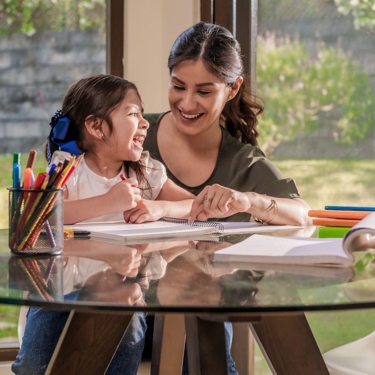 Mom helps her child review for her Houston online Spanish language course.