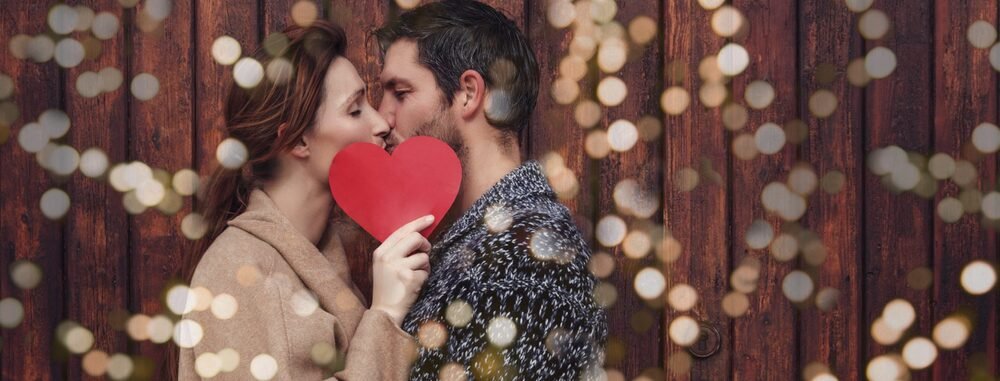 Couple kissing each other and celebrating Valentine's Day